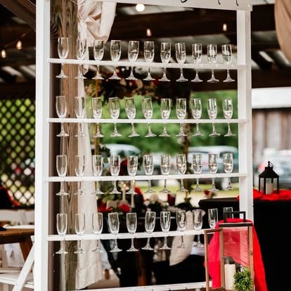 White champagne glass wall display for a wedding reception