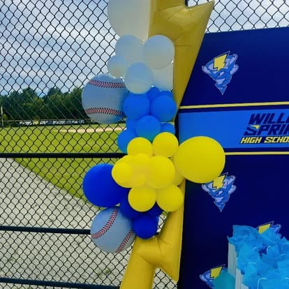Blue, white and yellow balloon column with baseball balloons for a high school senior celebration